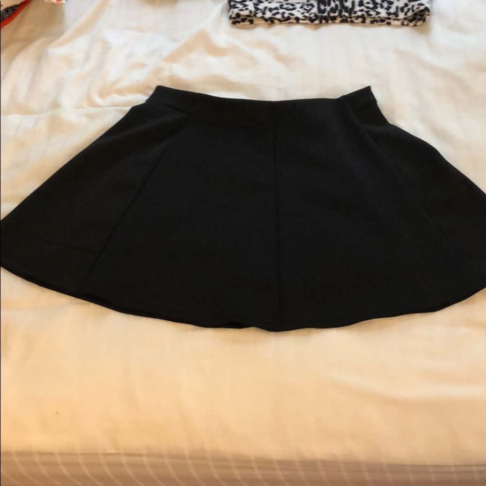 Black pleated mini skirt